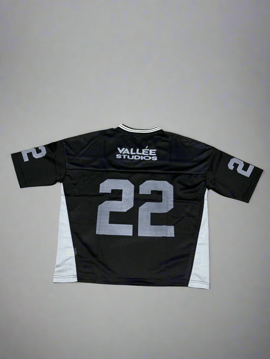 Black sports jersey with number 22 on a gray surface